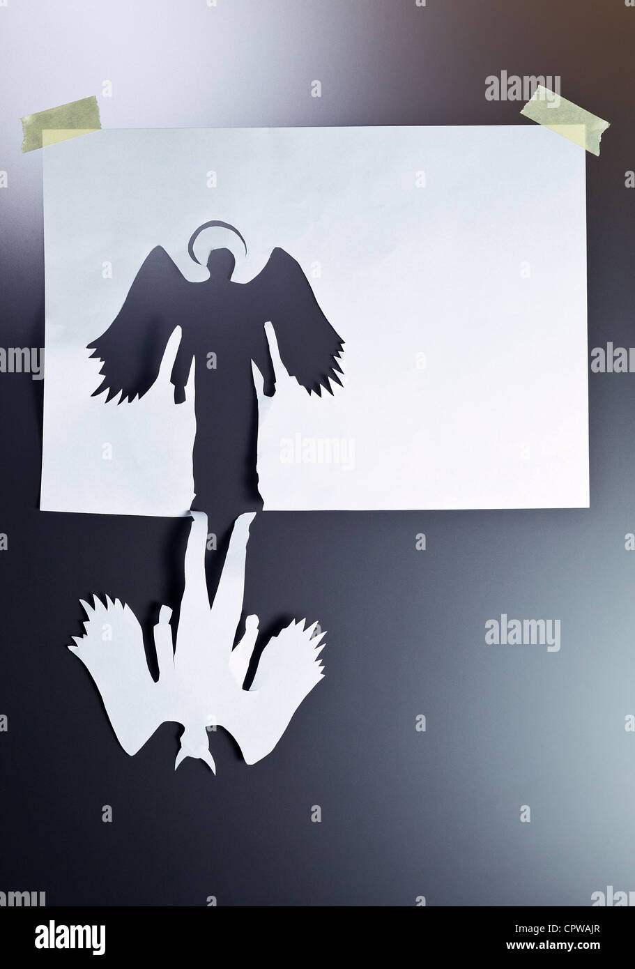 angel and devil , place your text on a white paper. Stock Photo