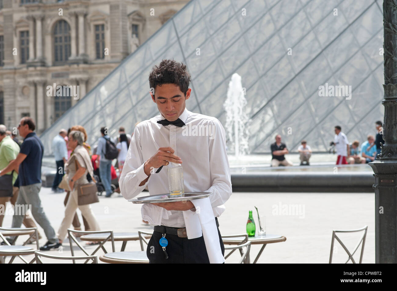 Paris, France A waiter in the Louvre area Stock Photo Alamy