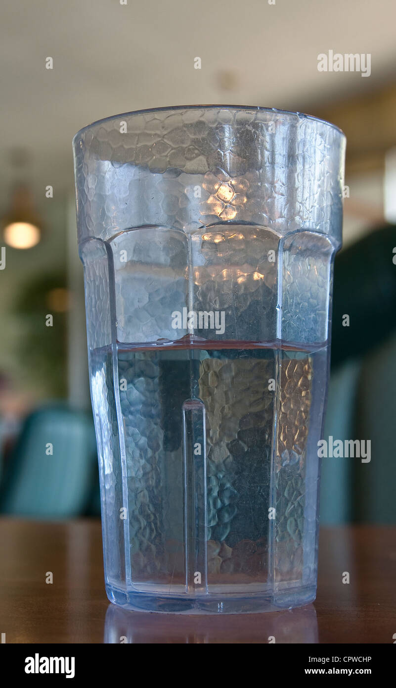 glass of water that is half full or half empty Stock Photo