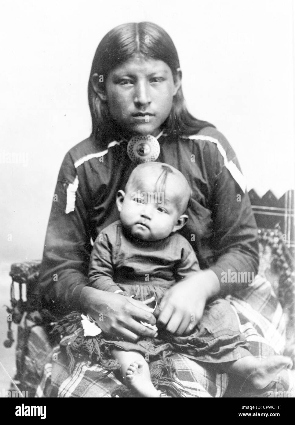 Squaw and papoose, Osage woman, holding child. Stock Photo