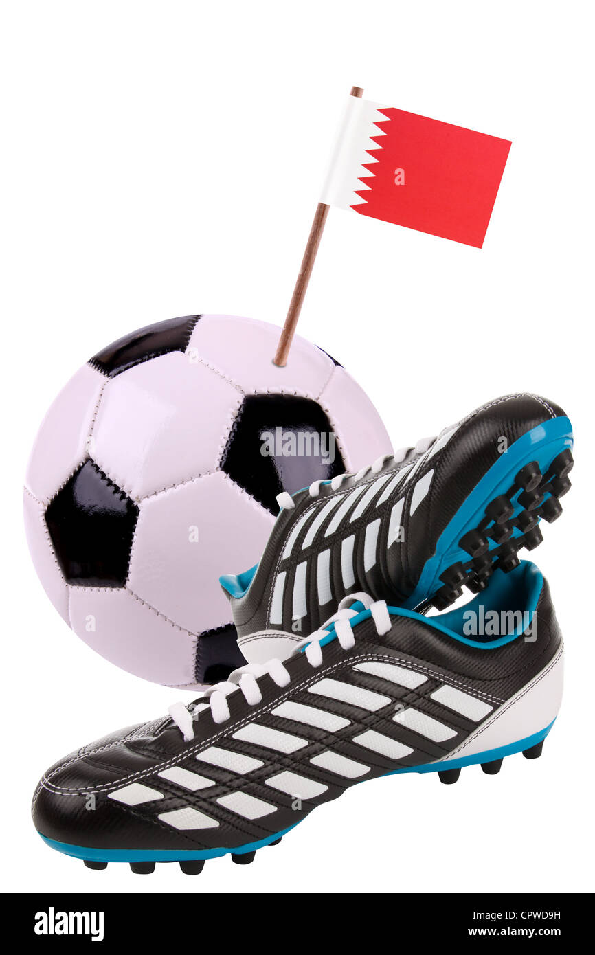 Pair of cleats or football boots with a small flag of Bahrain Stock