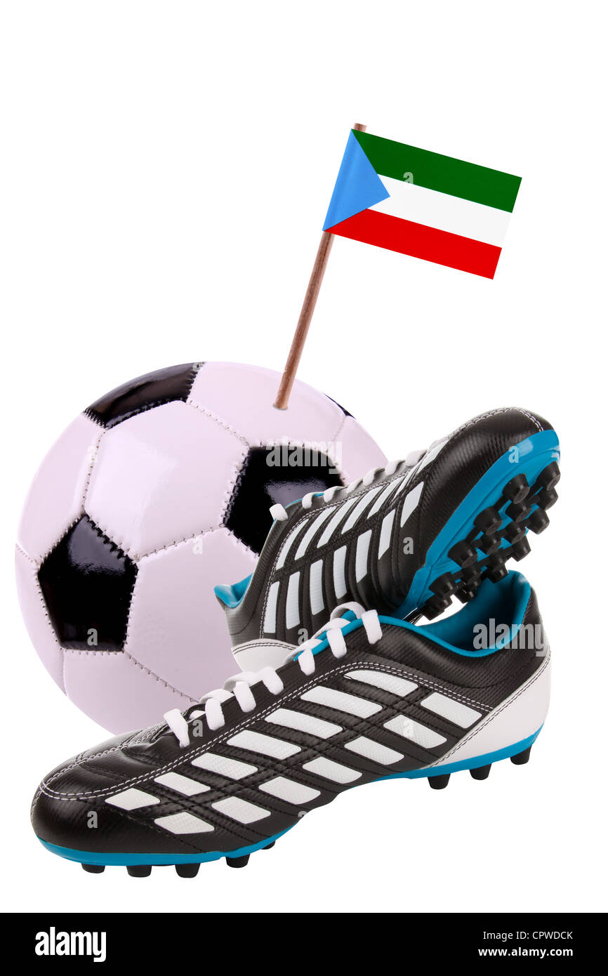 Pair of cleats or football boots with a small flag of Equatorial Guinea Stock Photo