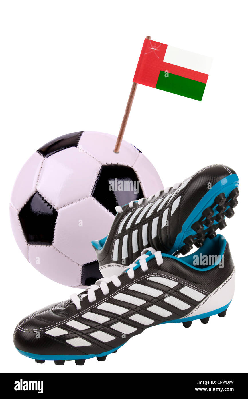 Pair of cleats or football boots with a small flag of Oman Stock Photo