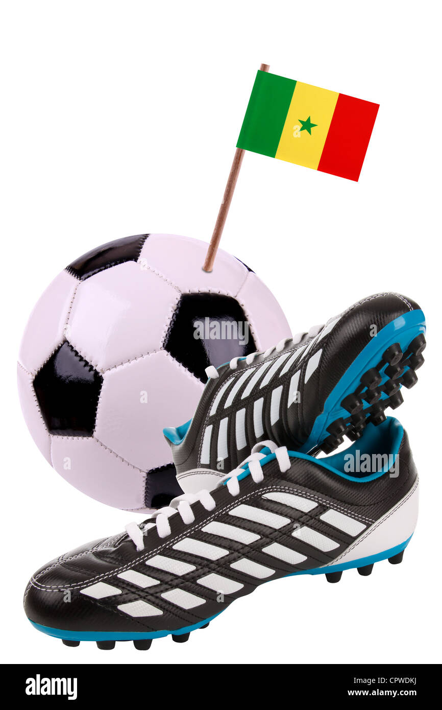 Pair of cleats or football boots with a small flag of Senegal  Stock Photo