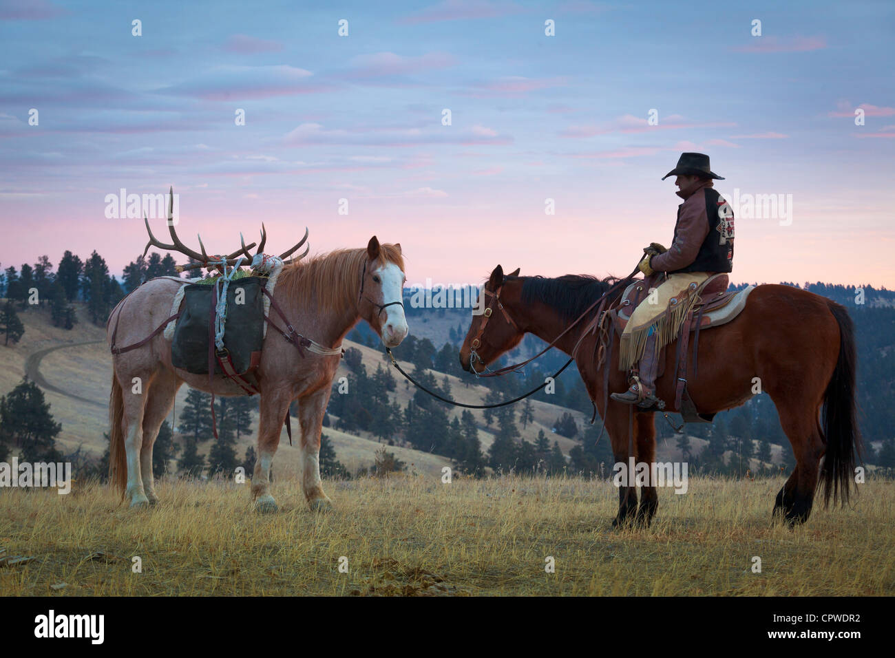 Cowboy on horseback in northeastern Wyoming Stock Photo