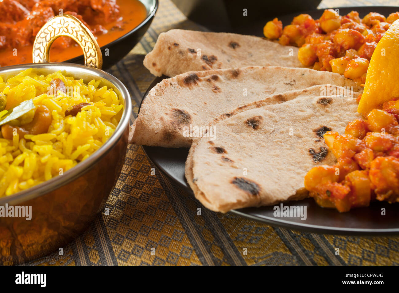 Chapatis with channa dhal, pillau rice and rogan josh. Stock Photo