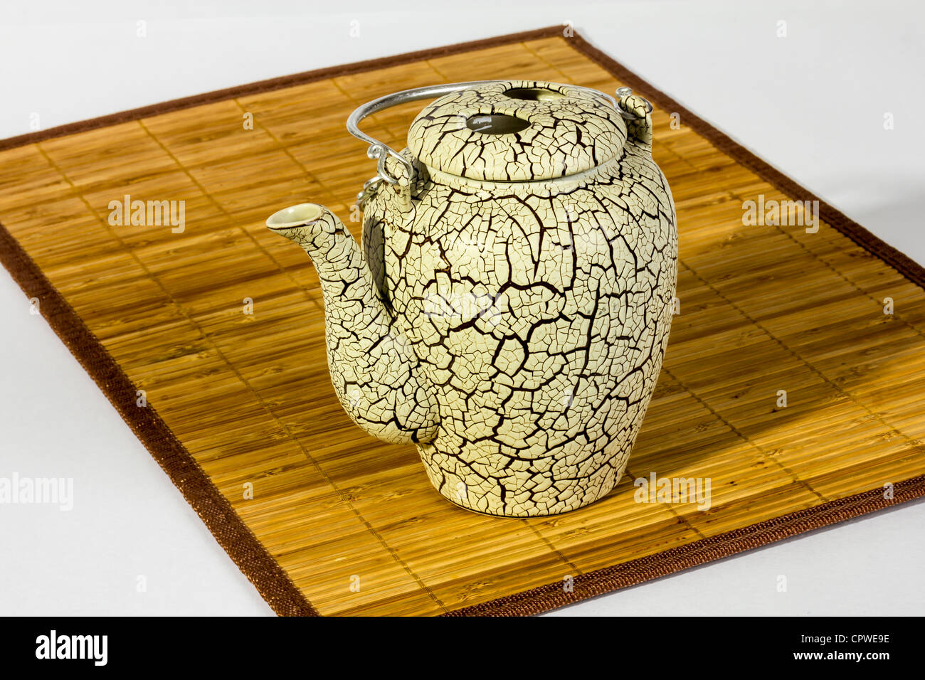 Cracked glaze chinese teapot on bamboo placemat Stock Photo Alamy
