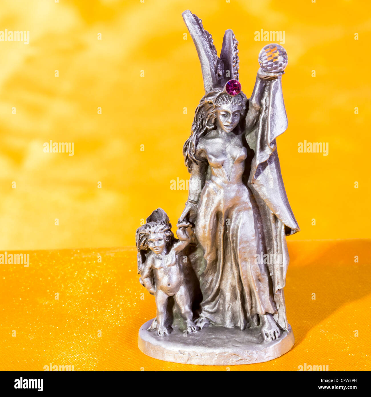 Pewter figurine angels holding globe Stock Photo