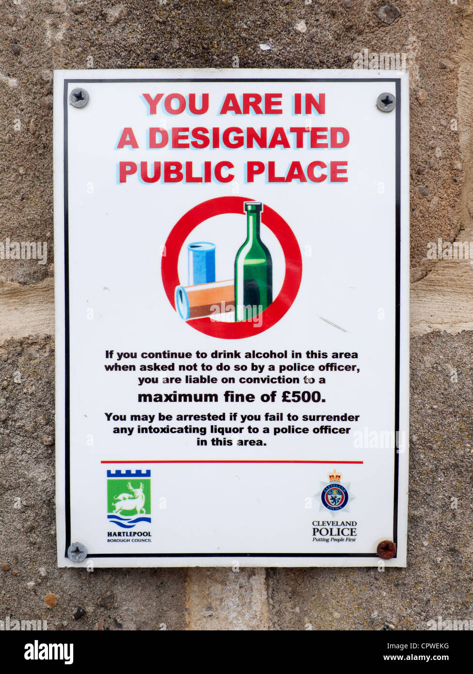 Sign warning You Are In a Designated Public Place where restrictions on drinking alcohol apply Stock Photo