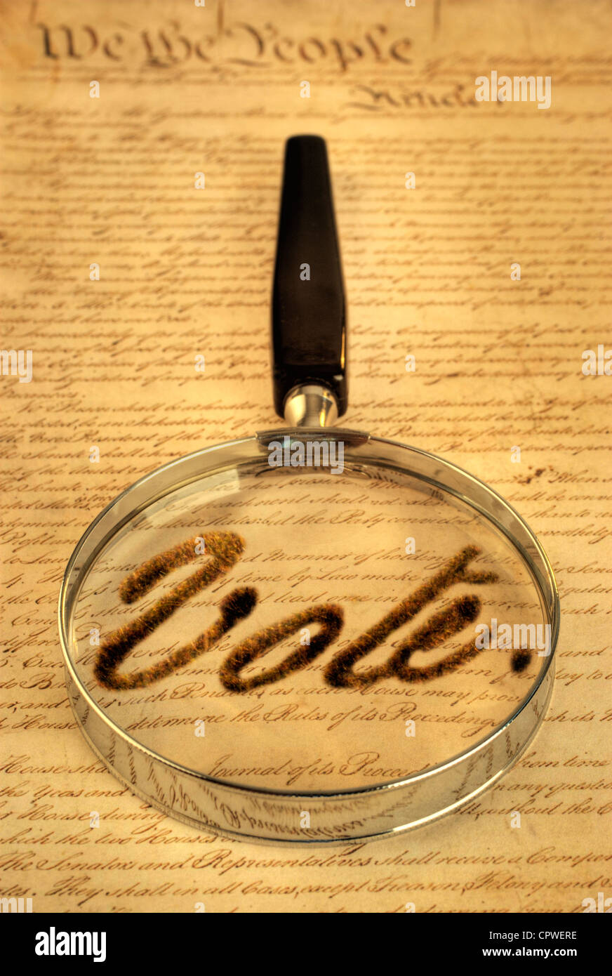 American Constitution and magnifying glass, with the word 'vote' taken from the document. Stock Photo