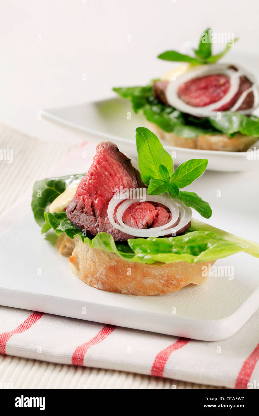 Roast beef open faced sandwiches Stock Photo - Alamy