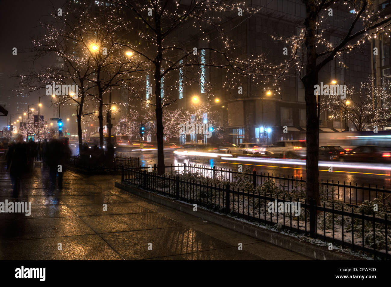 An early December snowstorm catches Christmas shoppers by surprise on Michigan Avenue in Chicago