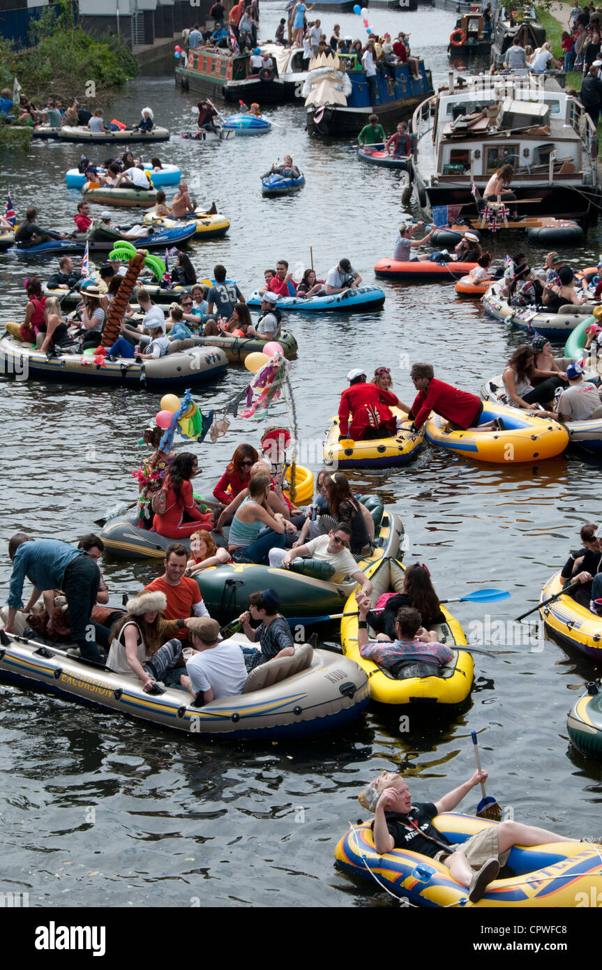 Queen's Jubillegal flotilla floating party, Regent's Canal, East London.Party goers in inflatable dinghies float down the canal. Stock Photo