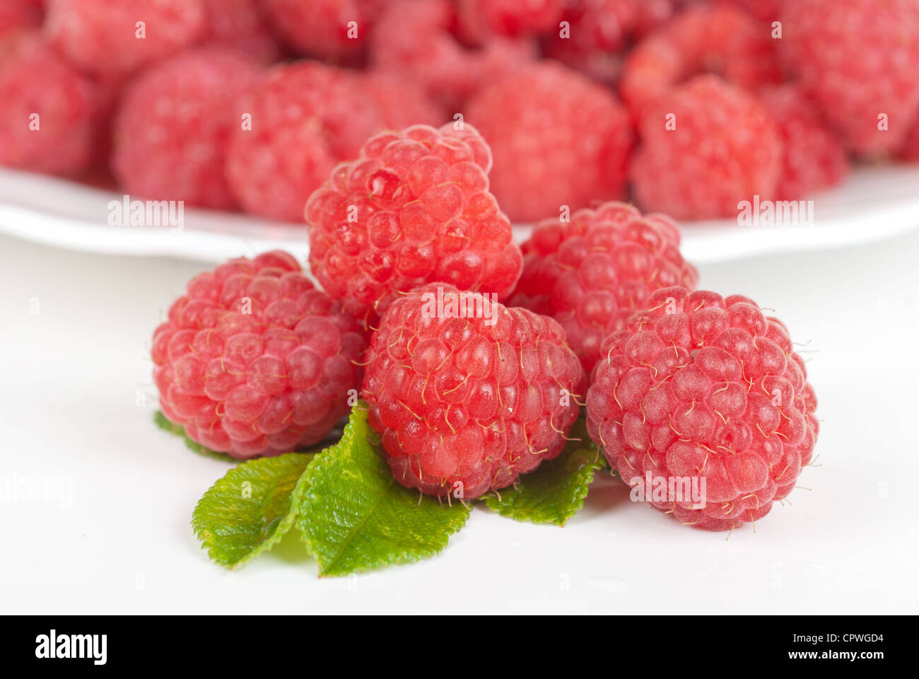 fresh raspberry closeup on a white background Stock Photo - Alamy