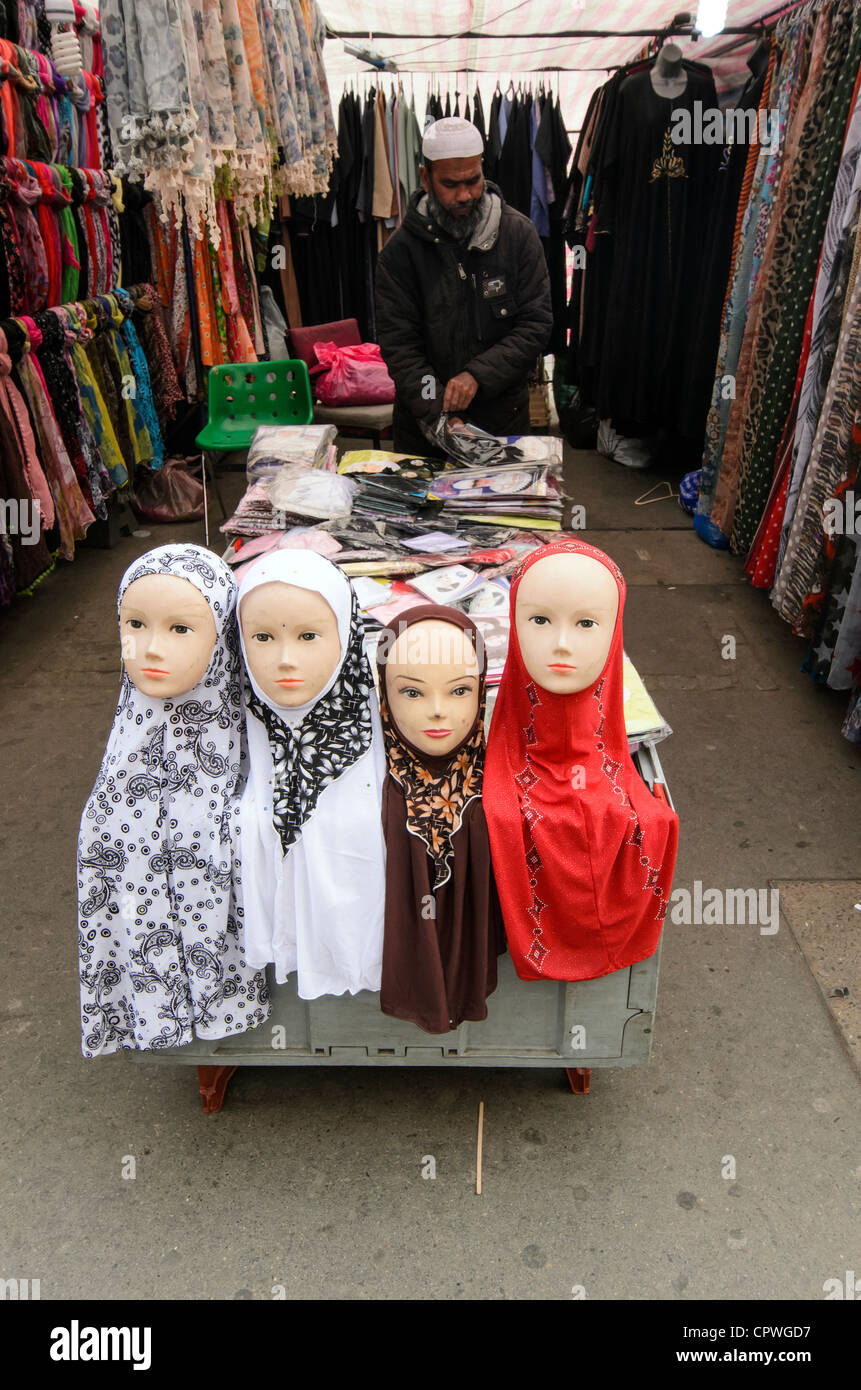 Head scarves for sale at a stall selling clothes for Muslims on Market - Whitechapel, London - England Stock Photo