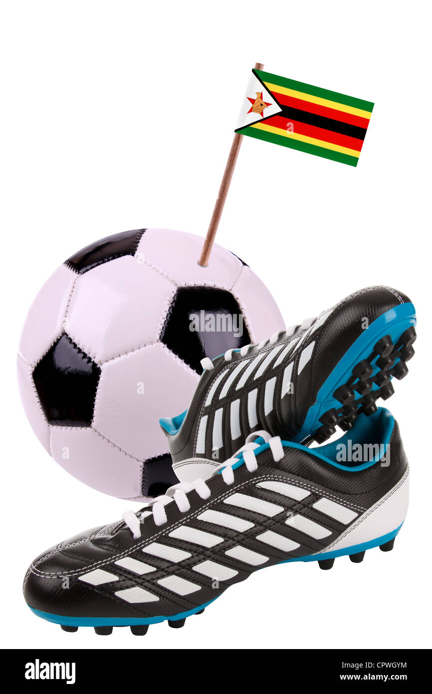 Pair of cleats or football boots with a small flag of Zimbabwe Stock