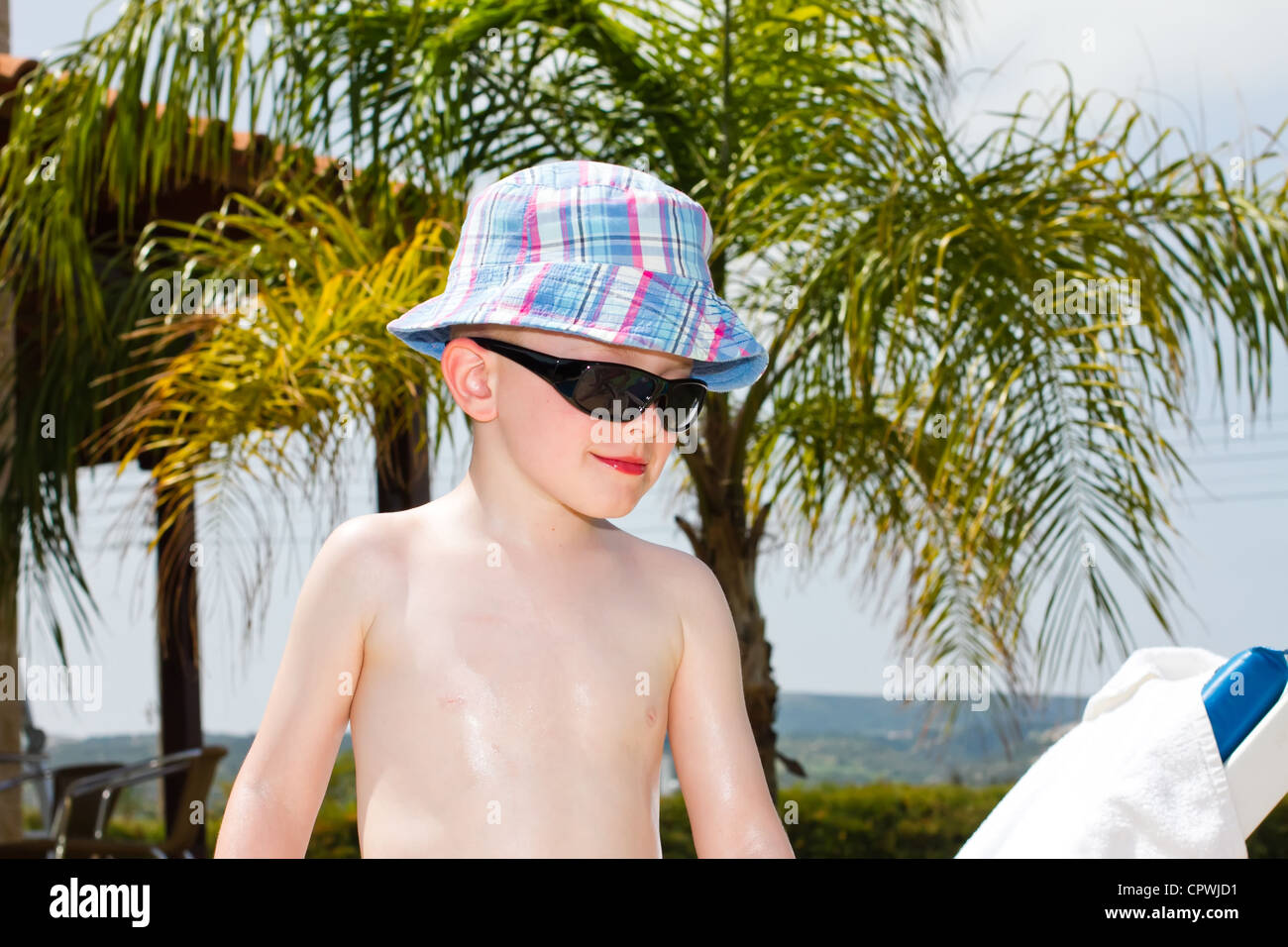 little boy oiled up with sun cream Stock Photo
