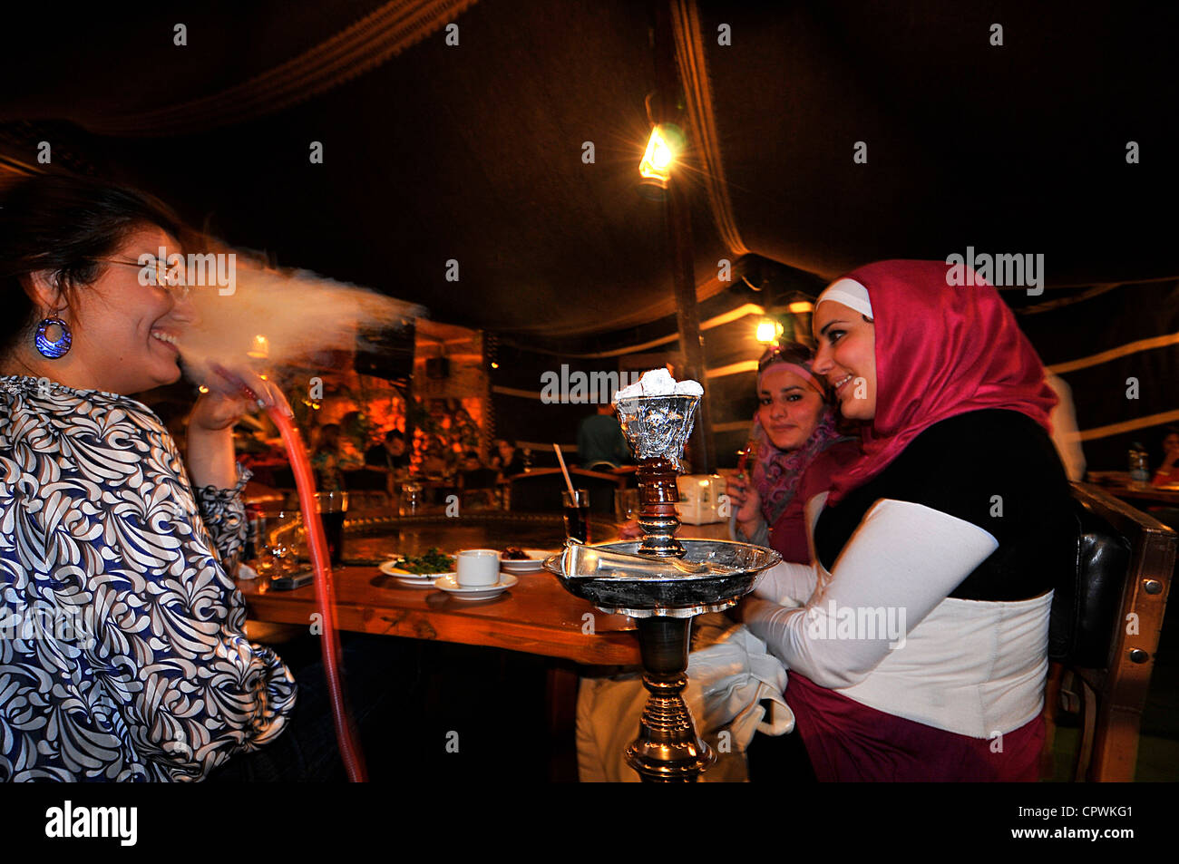 Asia Jordan Amman Girls smoke hookah in a typical restaurant Stock