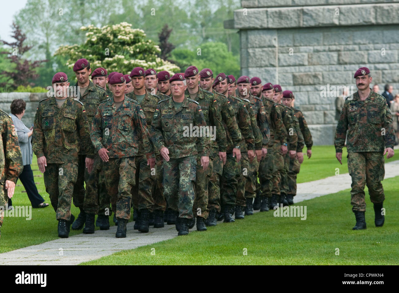 German soldiers march into the German Cemetery at La Cambe during a ...
