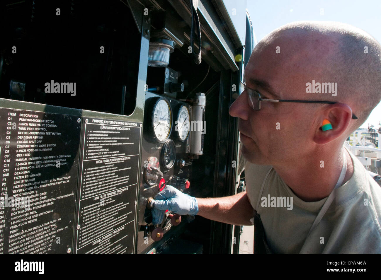 Tech Sgt. Christopher Rabon, from the 169th Logistics Readiness Squadron, ensures a R-11 refueling truck control panel is working properly at McEntire Joint National Guard Base, S.C., June 2, 2012. Rabon occupies the 'C-man' crew position of a checkpoint inspection team. He is in charge of function checks of the rear and underbelly operations of the vehicle which include, draining the filter separator and performing low point drains. Stock Photo