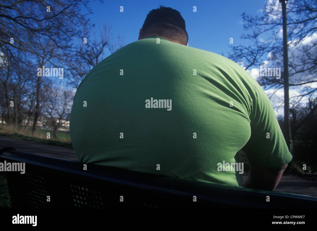 colossus of obese man from the rear Stock Photo