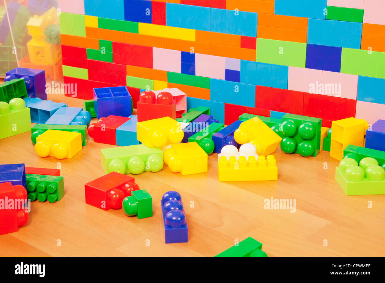 Building a wall made of toy blocks in kids room Stock Photo - Alamy