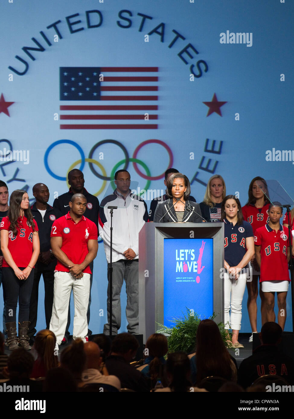 First Lady of the United Sates of America Michelle Obama speaks to media with USA Olympic athletes on stage Stock Photo