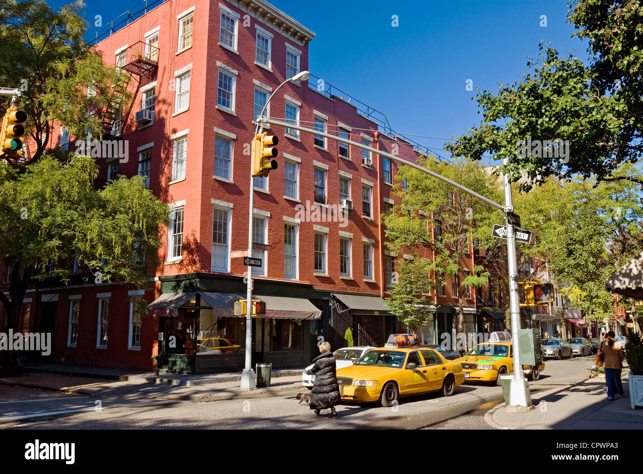 A shopper with a Prada shopping bag on Bleecker Street in Greenwich Village  in New York Stock Photo - Alamy