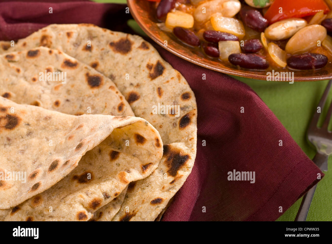 Indian chapatis or rotis with vegetarian curry. Stock Photo