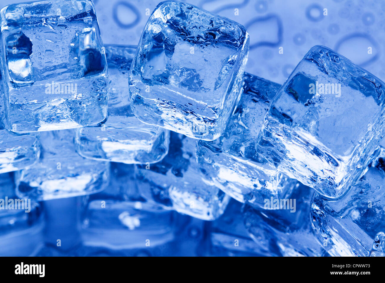 ice cubes in blue background Stock Photo - Alamy