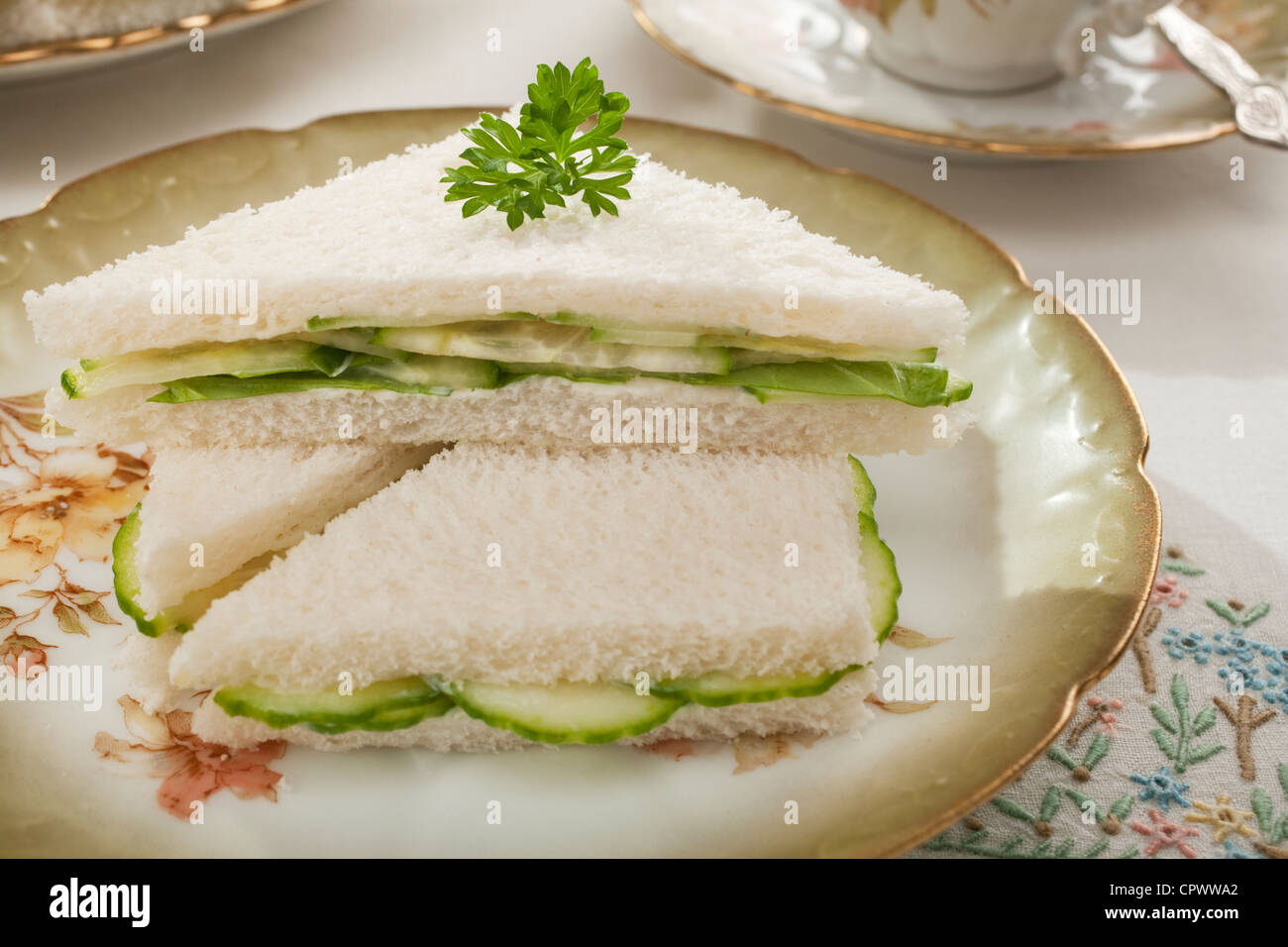 Cucumber sandwiches on old crockery Stock Photo