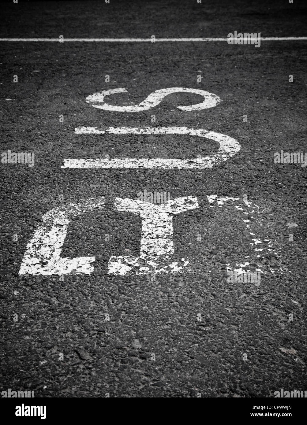 Bus stop label on the asphalt road Stock Photo