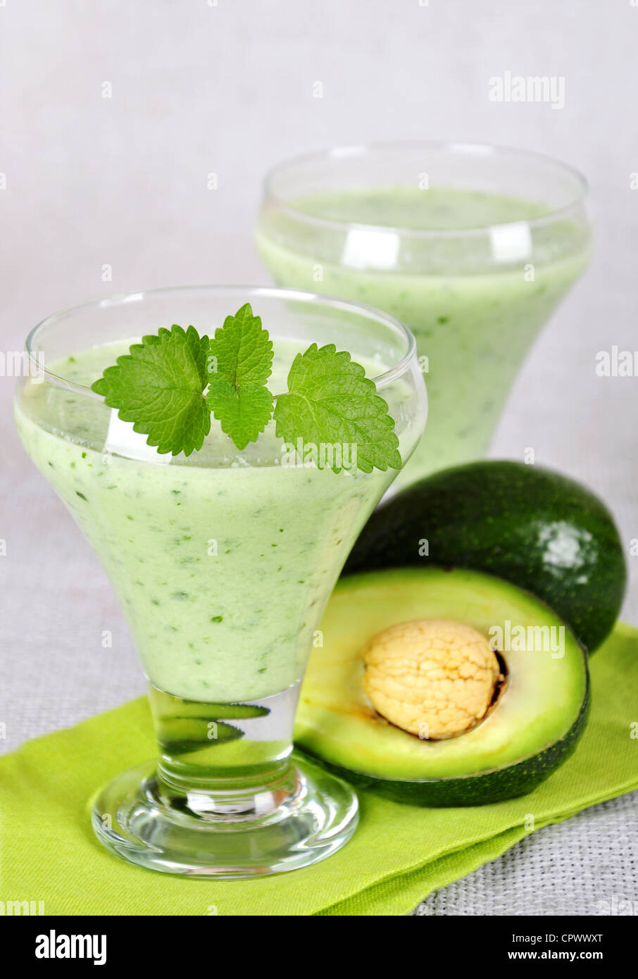 Two glasses of avocado smoothie with mint. Healthy drink  Stock Photo