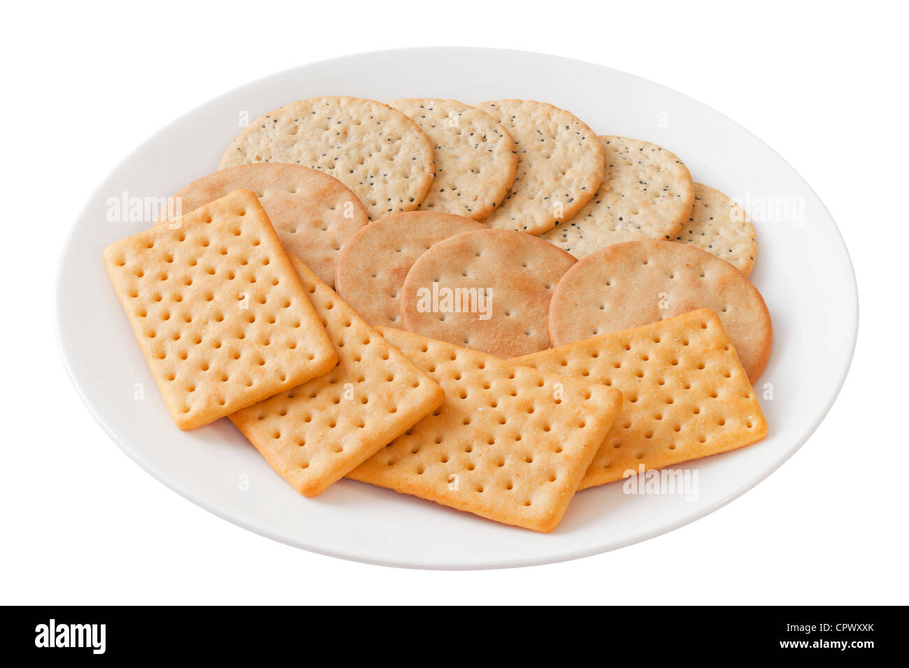 A selection of crackers or cheese biscuits on a white plate Stock Photo