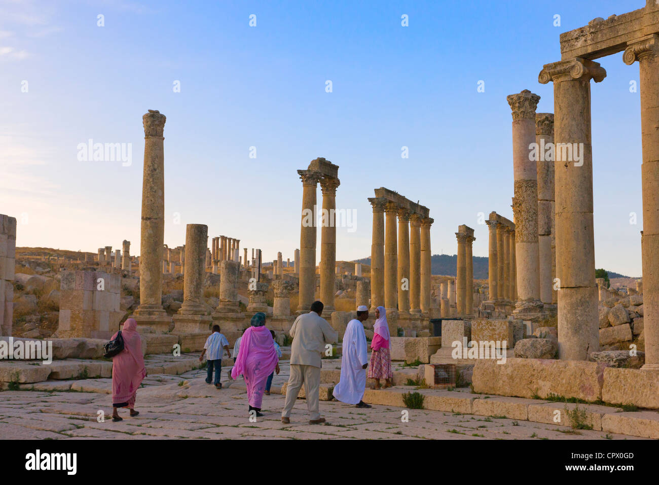 Tourists in column street, ancient Jerash ruins, Amman, Jordan Stock Photo