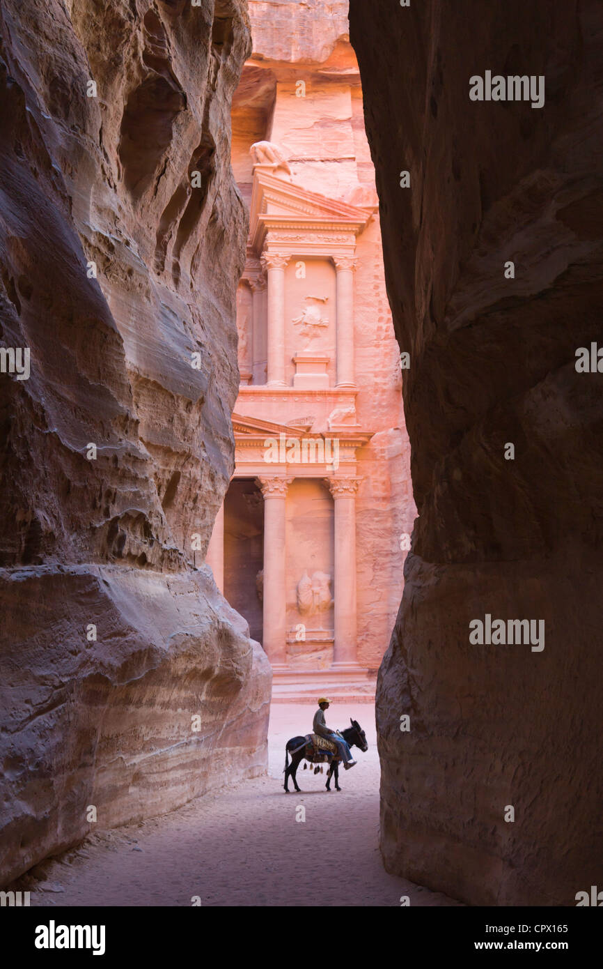 Tourists in Al-Siq leading to Facade of Treasury (Al Khazneh), Petra, Jordan (UNESCO World Heritage site) Stock Photo