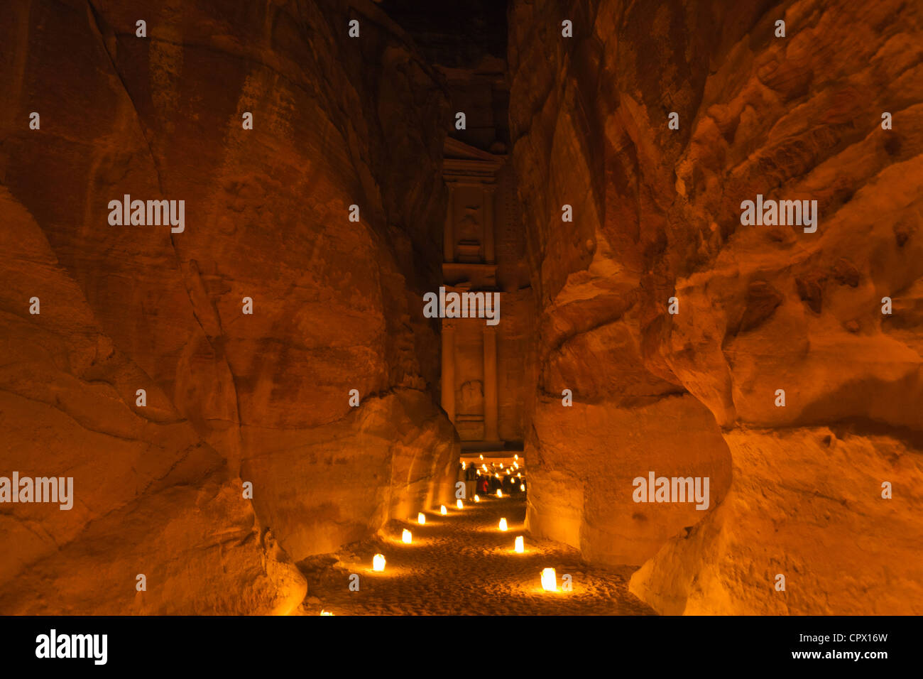 Night view of candles burning at Al-Siq leading to Facade of Treasury (Al Khazneh), Petra, Jordan (UNESCO World Heritage site) Stock Photo