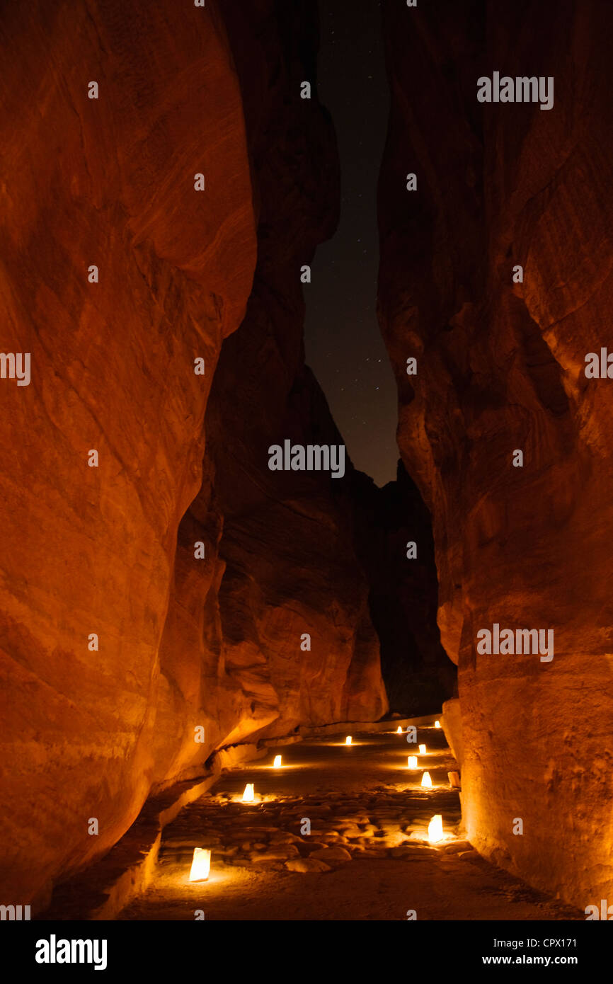 Night view of candles burning at Al-Siq leading to Facade of Treasury (Al Khazneh), Petra, Jordan (UNESCO World Heritage site) Stock Photo