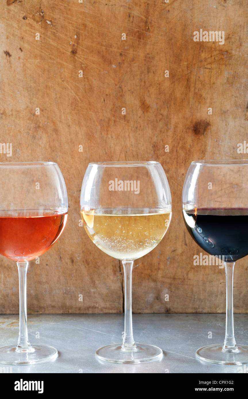 Rose, white and red wines in glasses Stock Photo