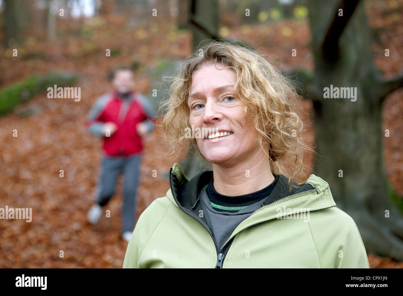 Portrait of mature woman in forest Stock Photo