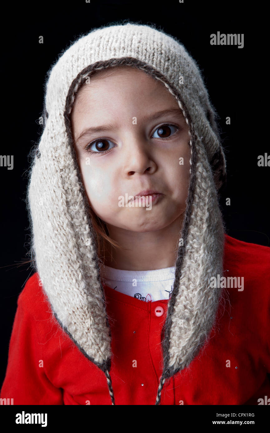 Portrait of a girl wearing a knit hat hires stock photography and