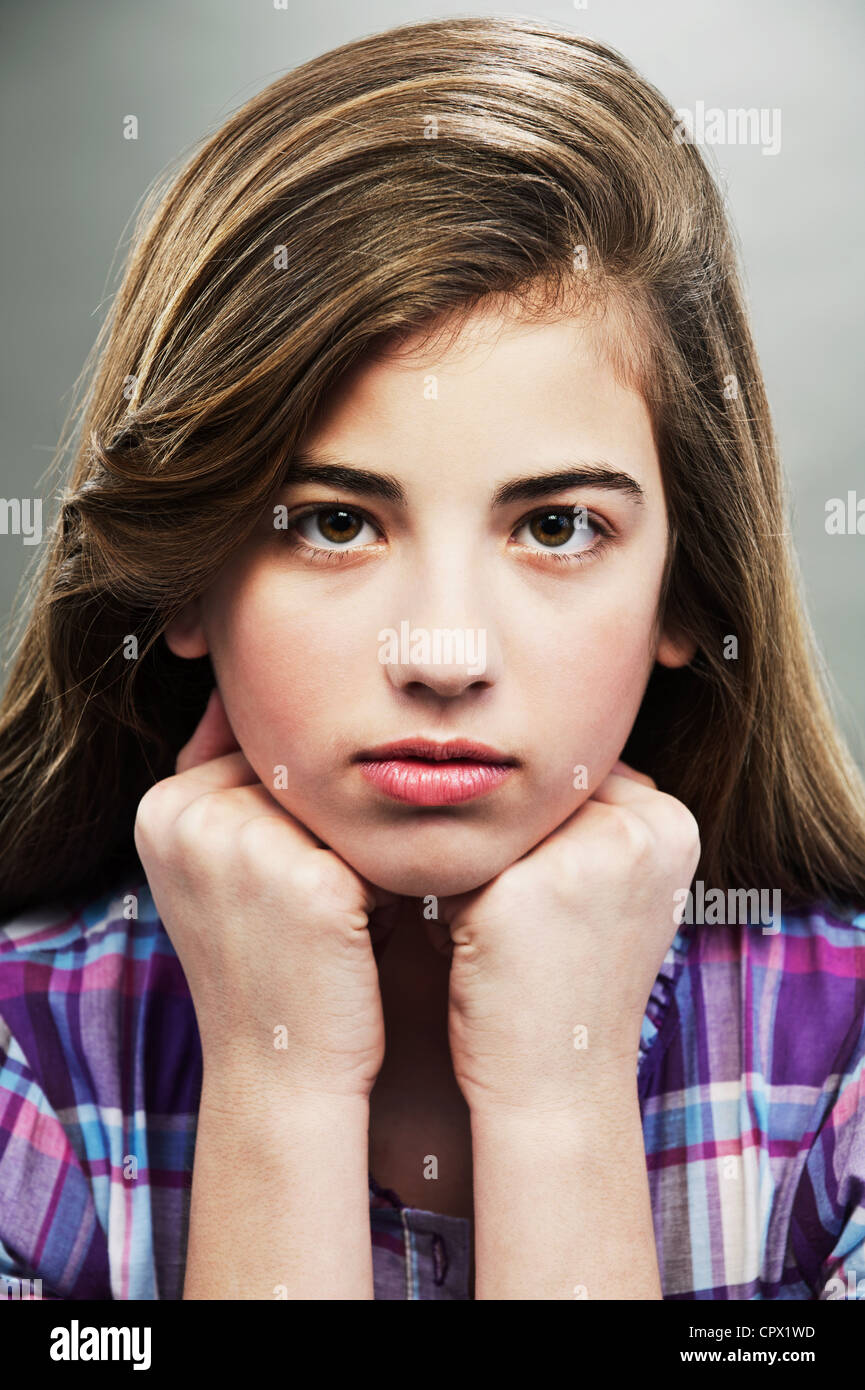 Portrait of young teenage girl, studio shot Stock Photo