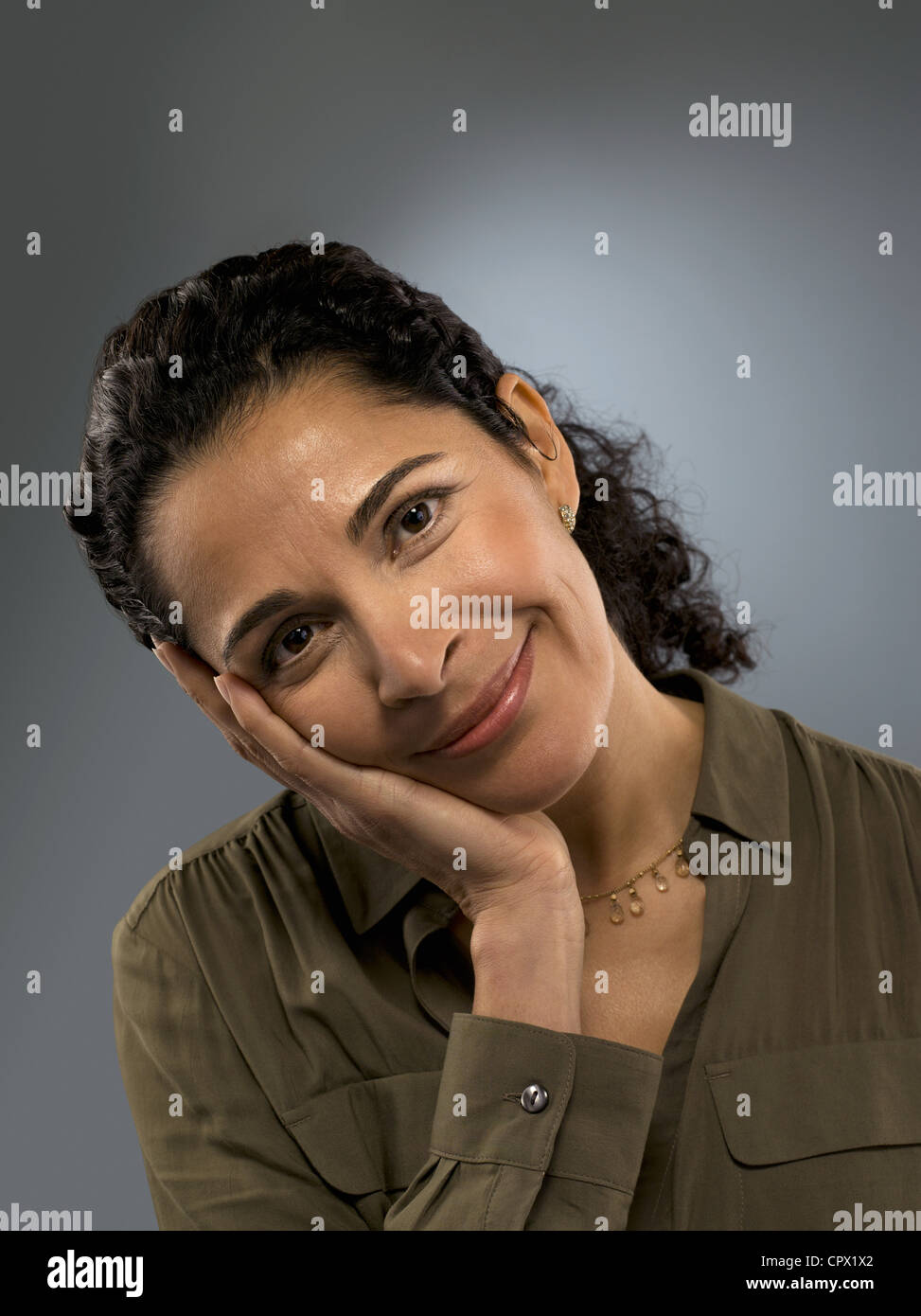 Portrait of mid adult woman, studio shot Stock Photo