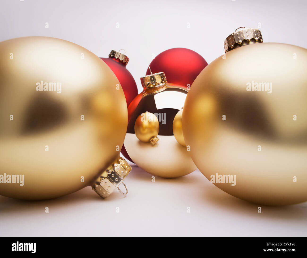 Gold Christmas decorations, studio shot Stock Photo