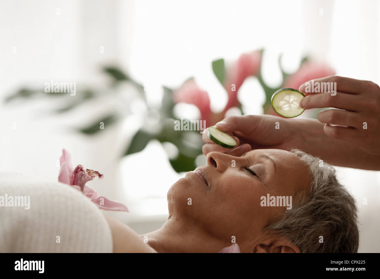 Senior woman relaxing on massage table Stock Photo