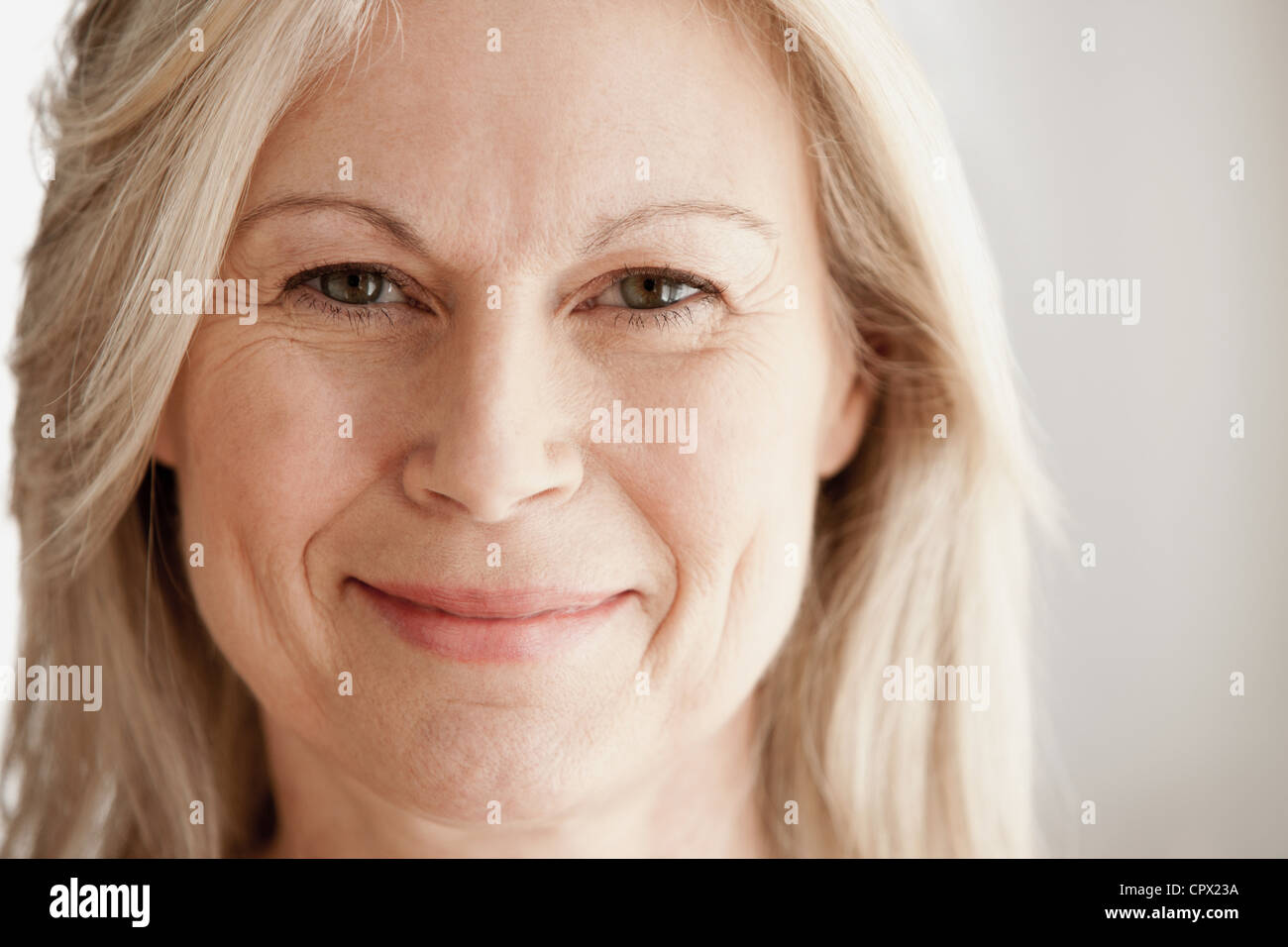 Portrait of mature woman, smiling Stock Photo
