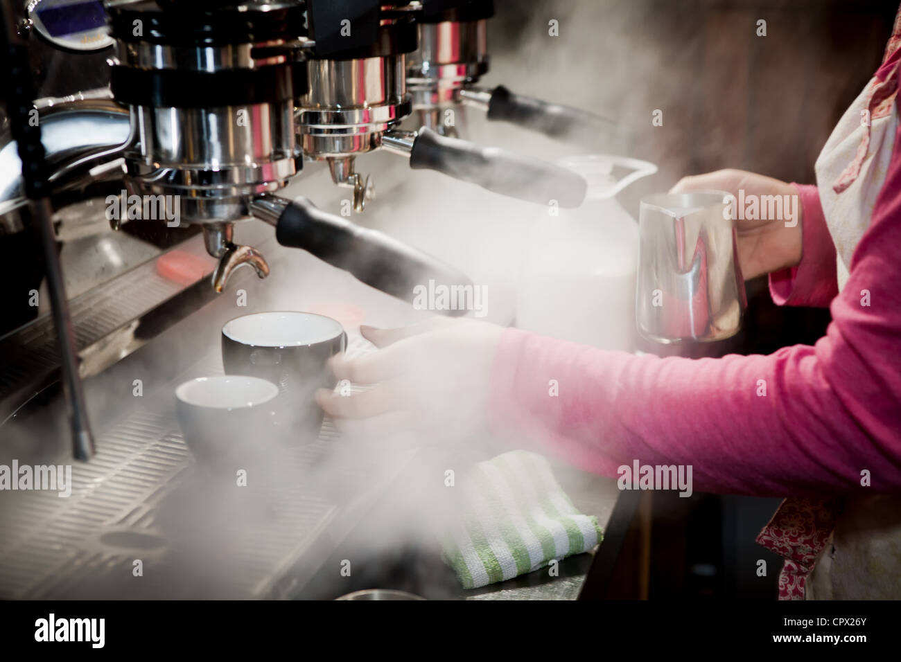 Barista making a latte Stock Photo