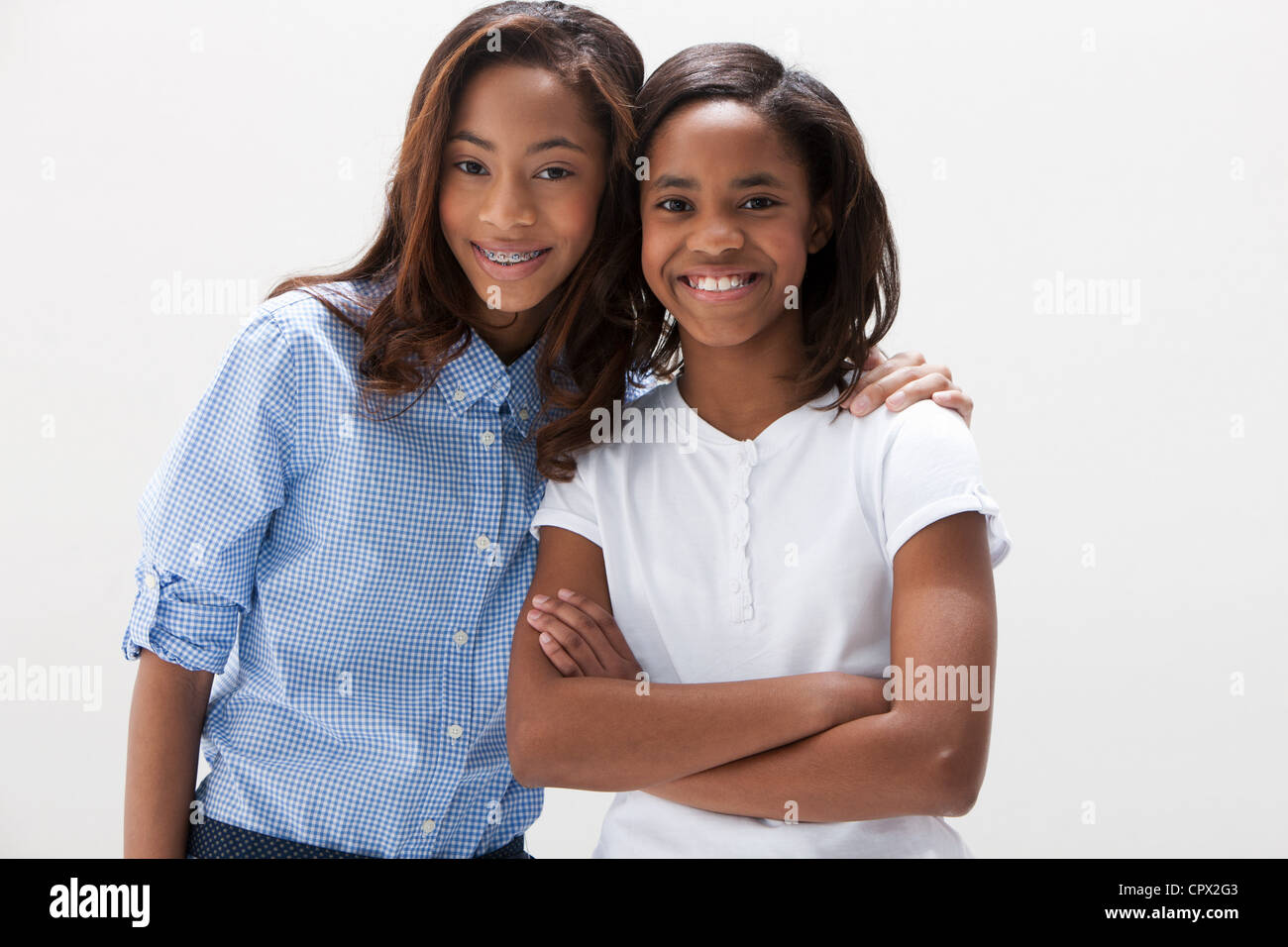 Portrait of African American sisters, studio shot Stock Photo