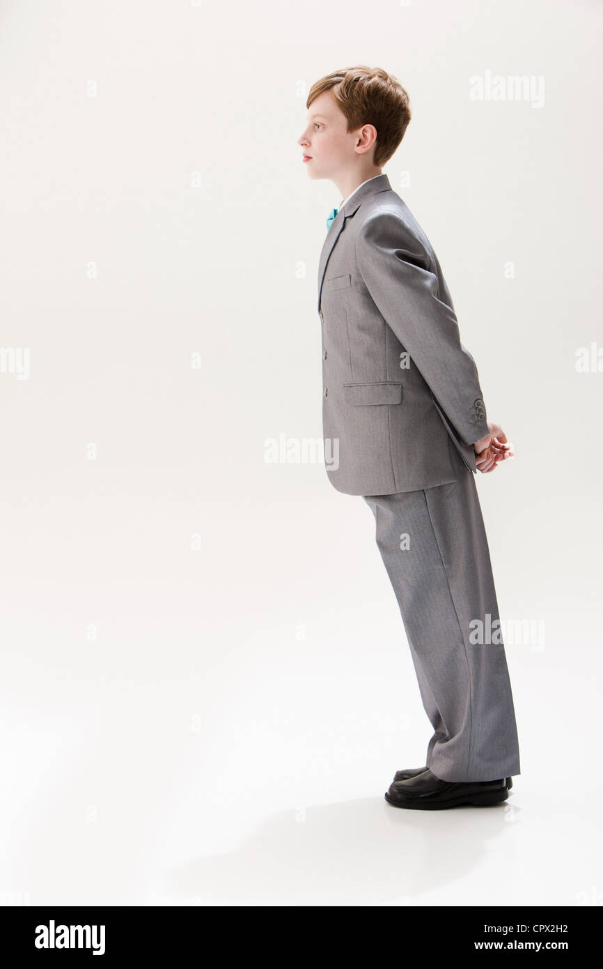 Boy wearing grey suit, studio shot Stock Photo