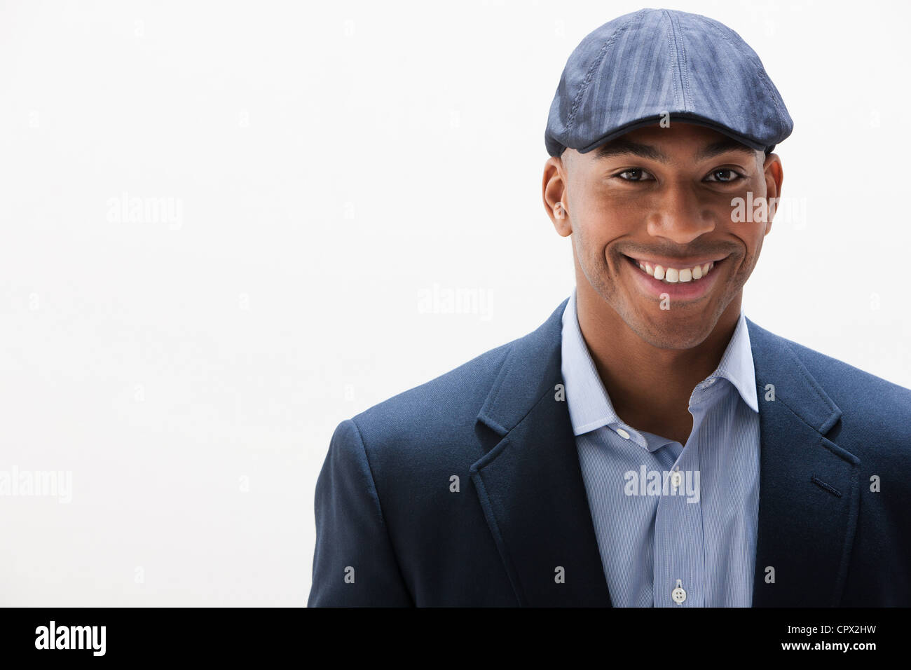 Portrait of African American man wearing cap, studio shot Stock Photo